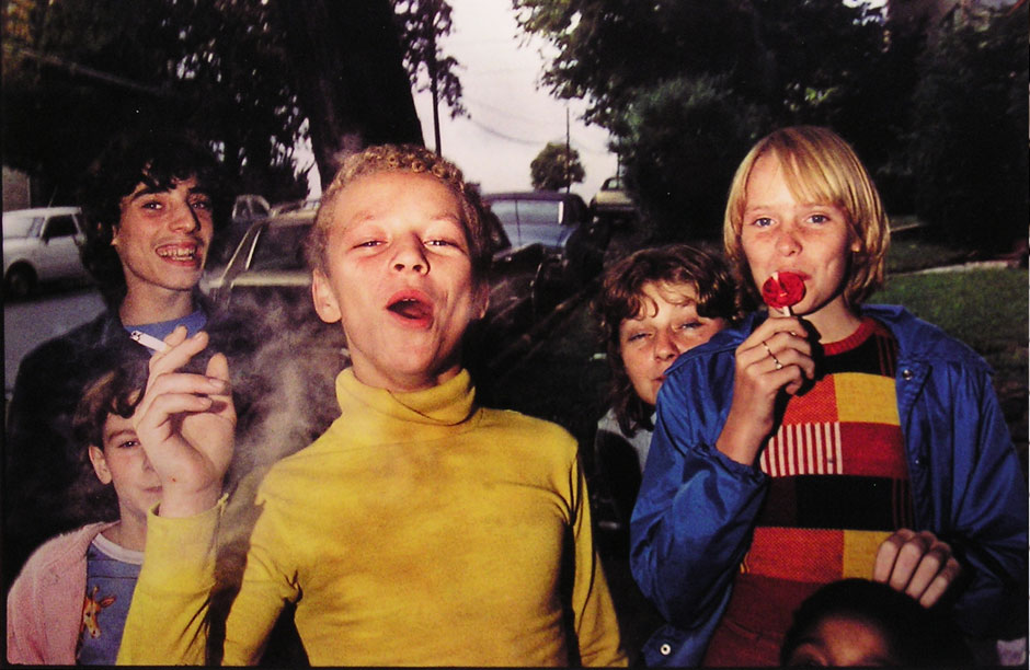 Mark Cohen, "Boy in Yellow Shirt Smoking, Scranton, PA" (1977) from the series titled "Grim Street". Courtesy of the artist and Robert Klein Gallery.