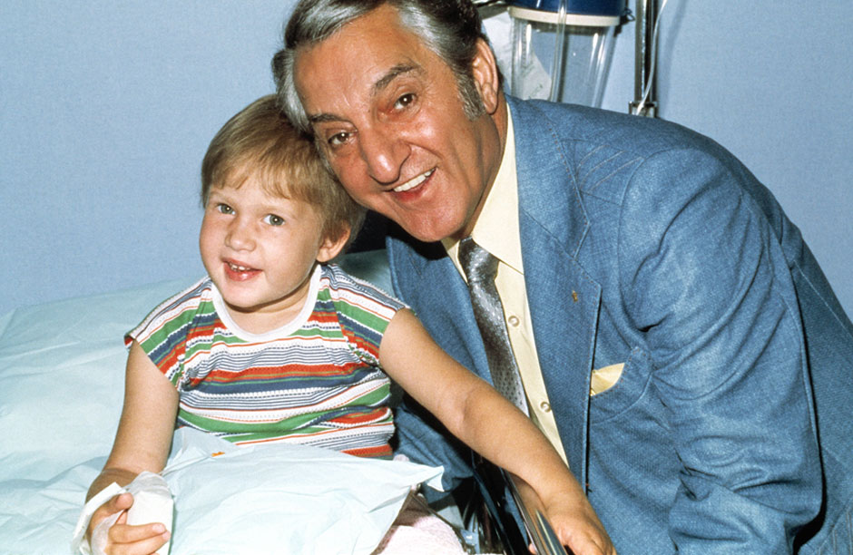 Danny Thomas, founder of St. Jude's Children's Research Hospital in Memphis Tennessee with a young patient in 1963.