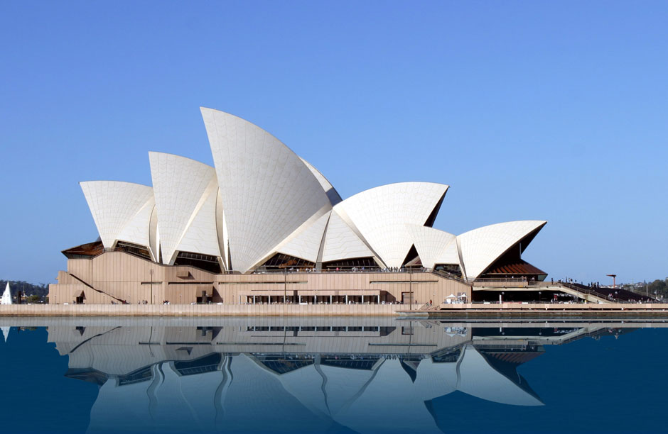 Sydney Opera House (Sydney, Australia) - The Sydney Opera house, completed in 1973, is starkly beautiful structure, which puts Sydney on the map in only the way that a truly original and iconic piece of architecture can. The building is a testament to the beauty of the content within. The Sydney Opera House programming includes some of the most high-end classical musical and operatic acts in the world. It is a cathedral to the arts, and much like the medieval churches calling to the Catholic God uses glass heavily to reflect light for the viewer in homage to the beauty of the place. The windows of the Sydney Opera house are in topaz green French glass and cover 6223 sq m (67,000 sq ft) of the surface of the building. The roof is covered with more than 1 million tiles, imported from Sweden. In all, the place is basically one huge refractive masterpiece. Both from places inside and all over outside light bathes the viewer. The touch of the sun allows the splendor the art within to take form in a fascinating and overpowering way.