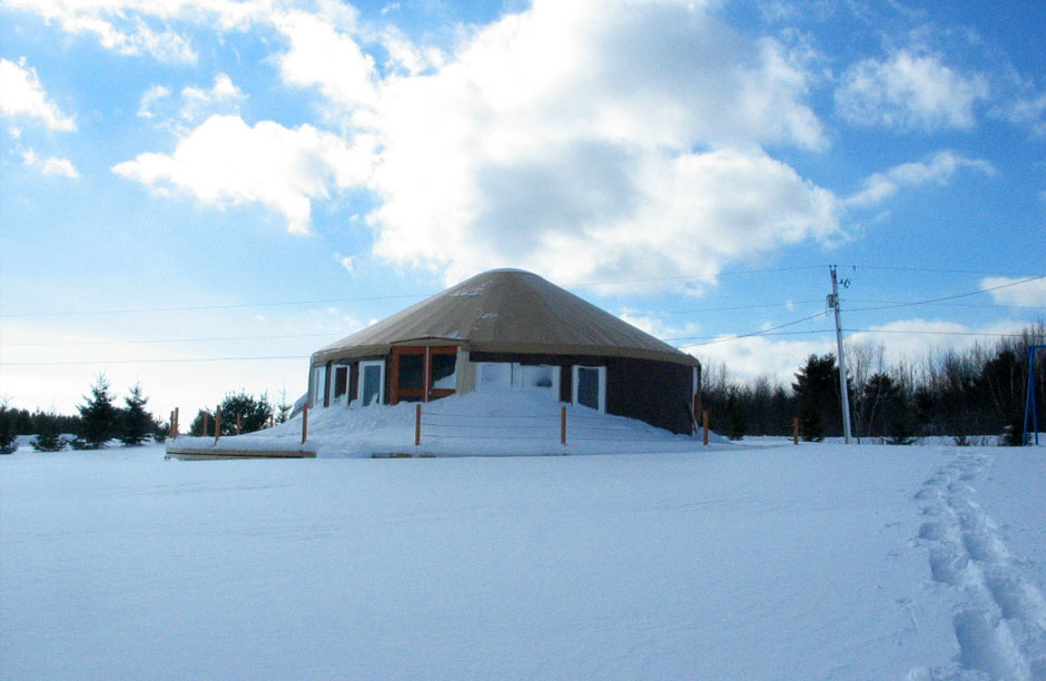 "The Little Smurf House Under Snow".  First Hurricane Earl and then a record snow fall for the region.  Now I know the yurt is steady.