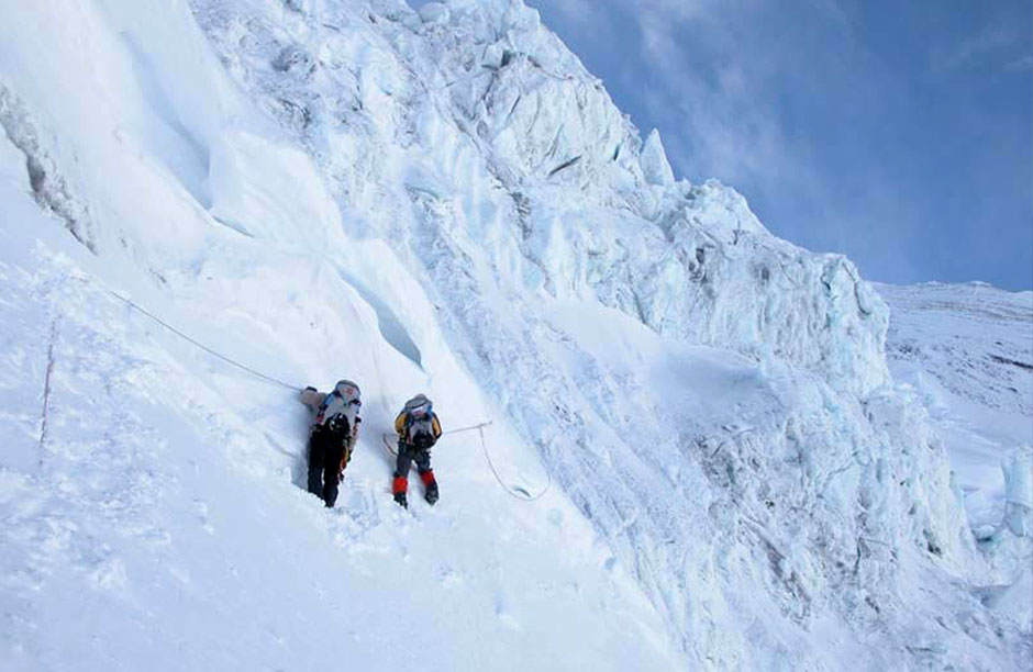 Anabelle Bond (right) and a climbing mate from her Chilean-based Everest team crossing a face on Everest in March 2004. Annabelle was the first woman to climb the 7 summits in under one year. She still holds that title today.