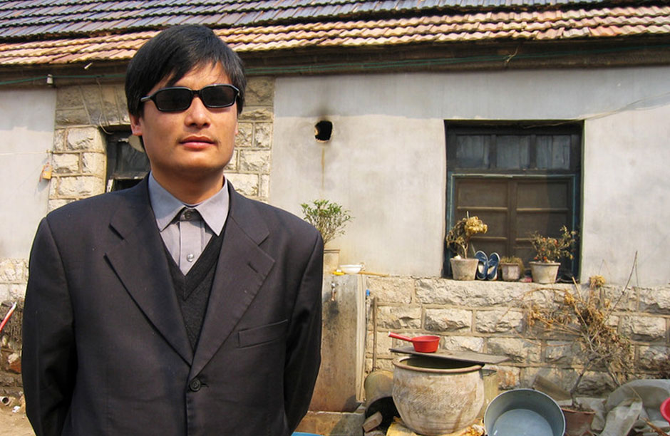 Chen Guangcheng in front of his former home in Linyi after serving four years in prison for organizing a class-action lawsuit against the city of Linyi for their harsh enforcement of China's "One-Child Policy"