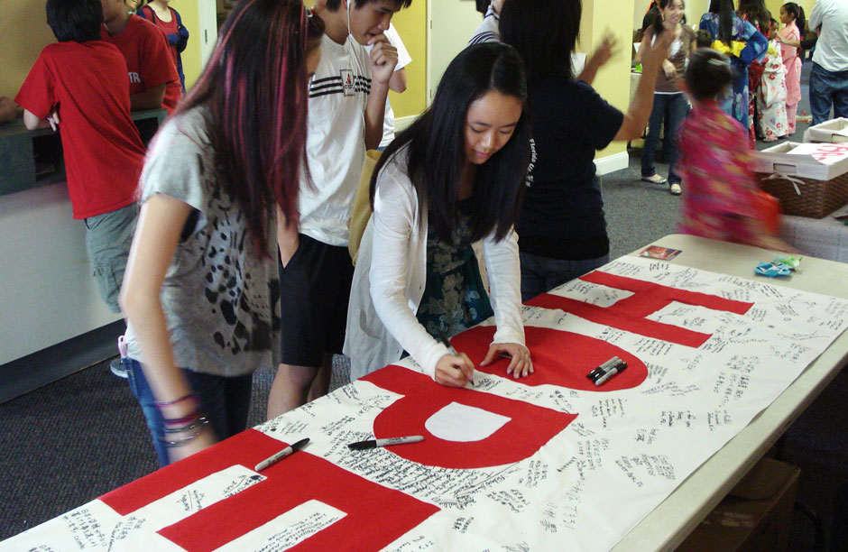 Sylvia Lai (at center), a freshman in college at the time of the earthquake in Japan, began spreading hope by taking action. She found inspiration in the story of Sadako Sasaki and her paper cranes.