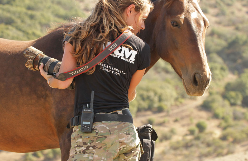 Australian-born, Rachel Taylor, volunteer investigator with Animal Recovery Mission, bonding with a wild mustang. "He became my shadow over a few days whilst documenting two rescue horses we named Epic and Lil' Kudo, in Santa Barbara, California," says Taylor.