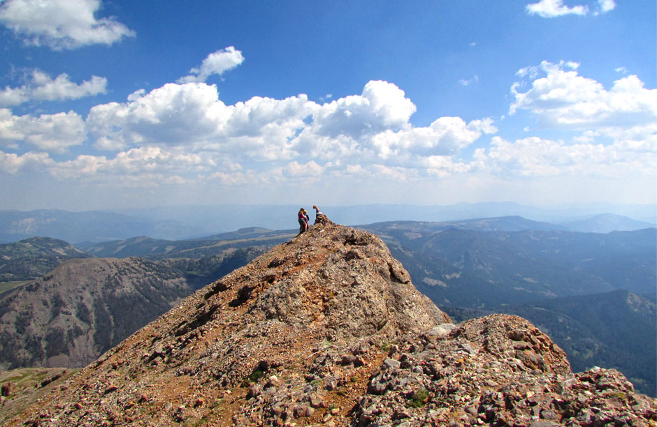 Summiting “The Sphinx” in hopes to find ourselves closer to solving its riddle. Montana’s Madison Range fills the horizon like waves on the ocean.